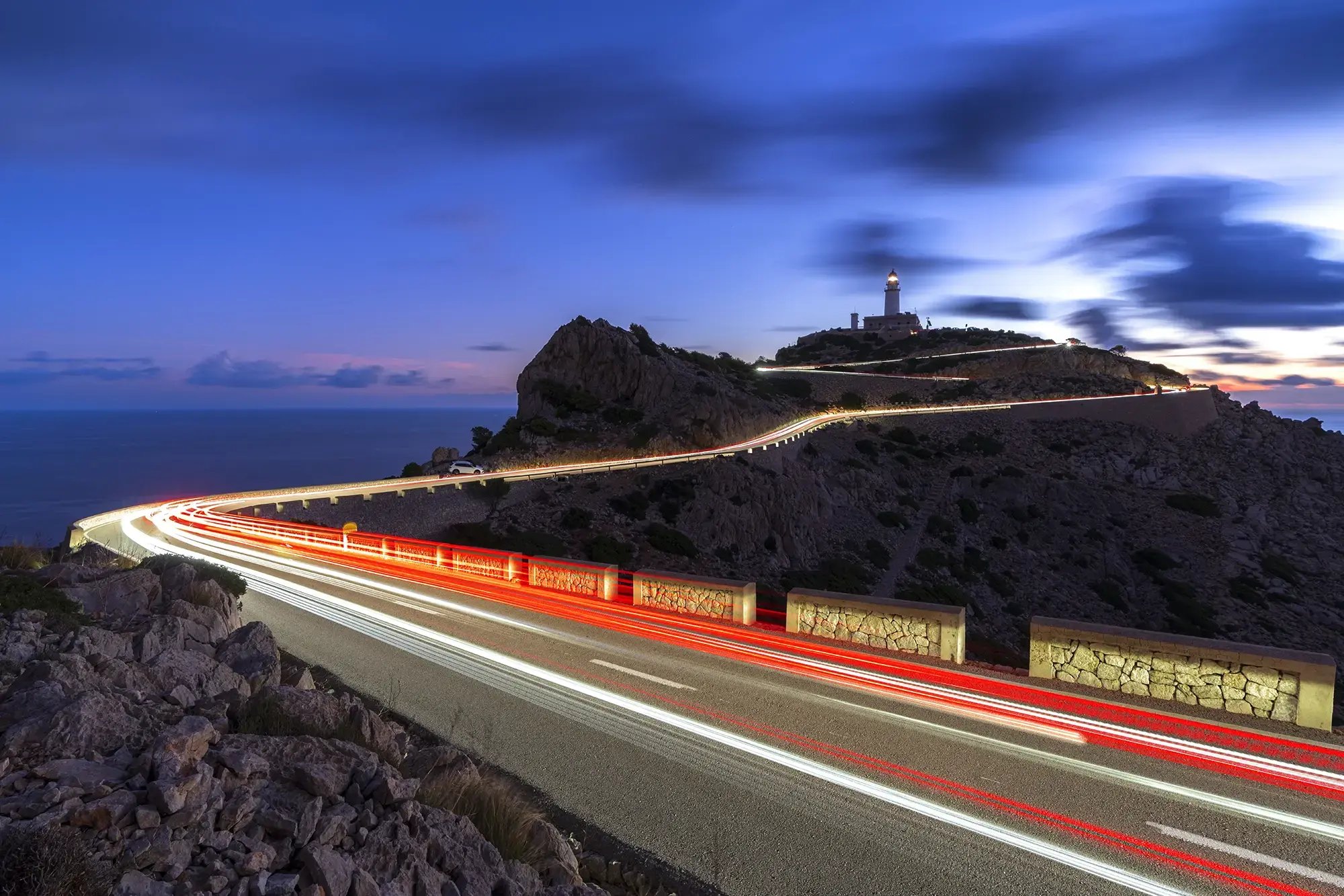 Lit up road leading to lighthouse