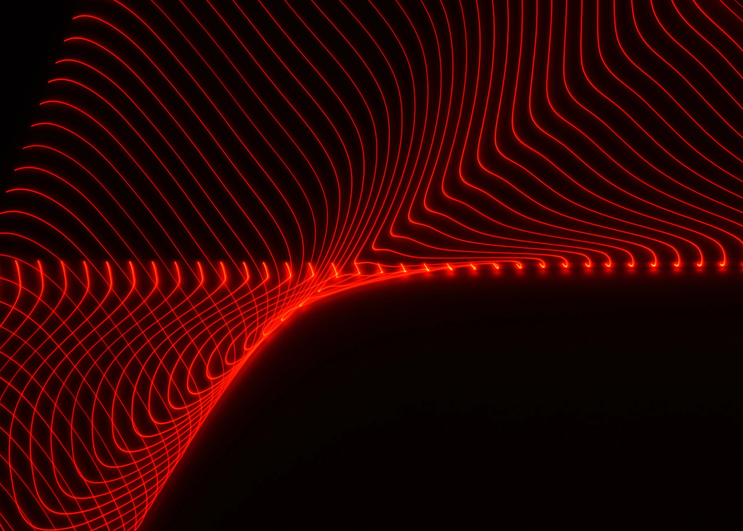 Red wave of light on black background